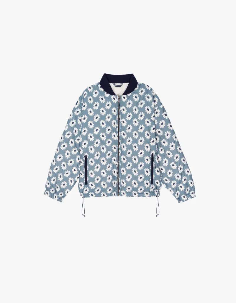 The Great The Reversible Ultra Light Down Puffer Jacket in Falling Daisy & Cream